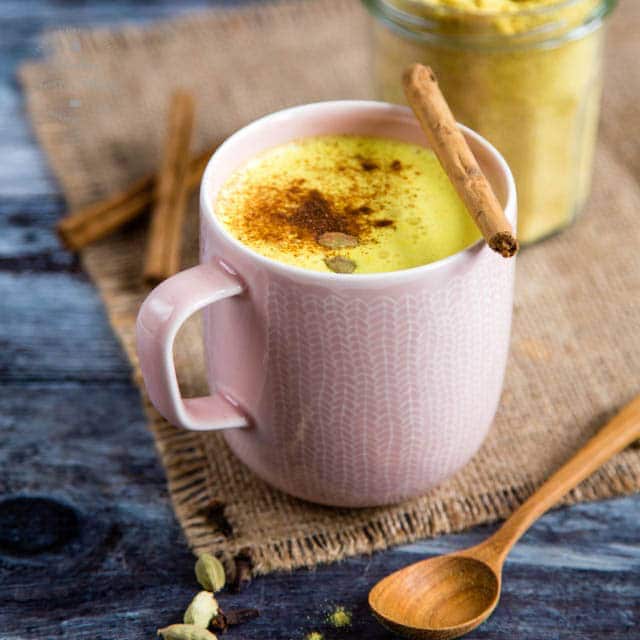 Turmeric latte in a pink cup.
